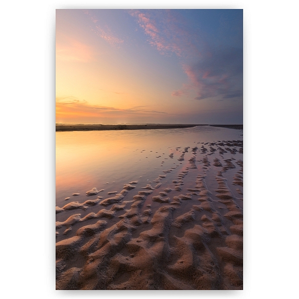 Zachte avondkleuren op het strand van Texel